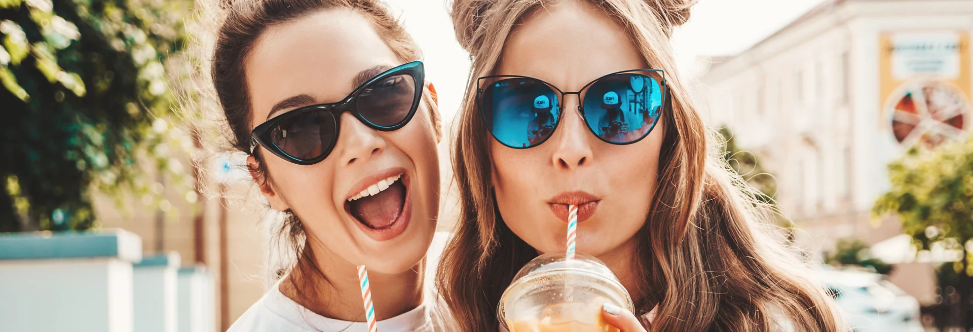 Two women wearing sunglasses